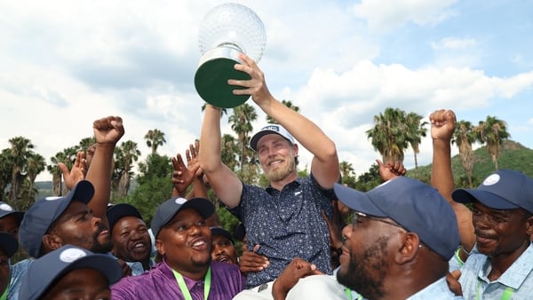 Kristoffer Reitan of Norway holds the trophy as he celebrates victory on the 18th green on day four of the Nedbank Golf Challenge in honour of Gary Player 2026 at Gary Player CC on December 07, 2025 in Sun City, South Africa