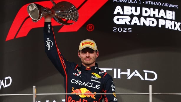 ABU DHABI, UNITED ARAB EMIRATES - DECEMBER 07: Race winner Max Verstappen of the Netherlands and Oracle Red Bull Racing lifts his trophy on the podium during the F1 Grand Prix of Abu Dhabi at Yas Marina Circuit on December 07, 2025 in Abu Dhabi, United Arab Emirates. (Photo by Clive Rose/Getty Image