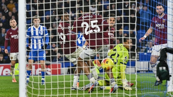 West Ham United's French goalkeeper #23 Alphonse Areola (bottom 2nd R) looks back as the ball crosses the line for a goal by Brighton's French midfielder #10 Georginio Rutter (not pictured) in the final minutes during the English Premier League football m