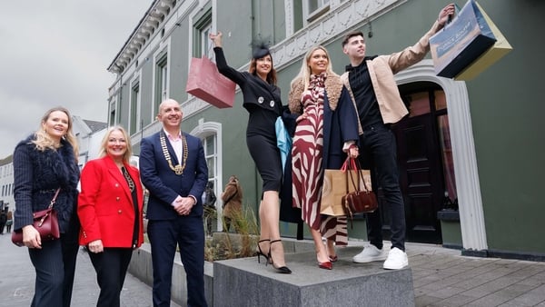 People pose at the launch of the Ennis Street Fashion Show