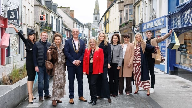 People pose at the launch of the Ennis Street Fashion Show