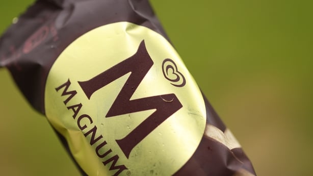 The brown and gold wrapper of a Magnum ice cream 