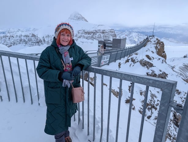 A woman posing in a snowy park