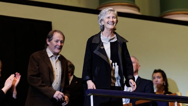 President Connolly and husband in balcony of National Concert Hall, taking audience applause on arrival at Sunday Miscellany Christmas concert, Dec 2025