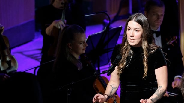writer Mia Doring on stage at the Sunday Miscellany Christmas concert, National Concert Hall, Dec 2025