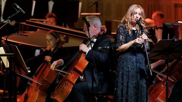 singer Lisa Lambe performing on stage with the RTÉ Concert Orchestra at Sunday Miscellany Christmas concert, National Concert Hall, Dec 2025