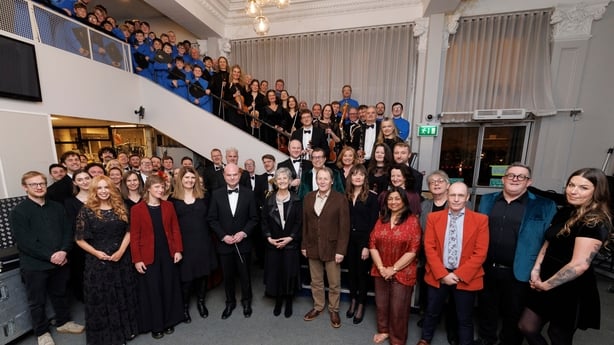 a group shot of the writers, singers, RTÉ Concert Orchestra and Palestrina Choir meeting President Connolly and husband backstage at the National Concert Hall, at Sunday Miscellany Christmas concert, Dec 2025
