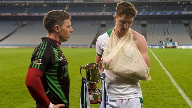 An injured Aidan Walsh celebrates Kanturk's All-Ireland intermediate final victory over Ballyragget in Croke Park with team-mate Anthony Nash