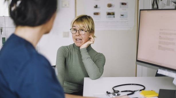 woman speaking with GP