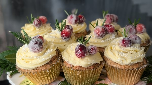 Festive muffins decorated with berries and icing
