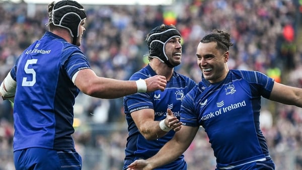 12 October 2024; James Lowe of Leinster celebrates with teammates Caelan Doris and James Ryan after scoring their side's first try during the United Rugby Championship match between Leinster and Munster at Croke Park in Dublin. Photo by Brendan Moran/Spor