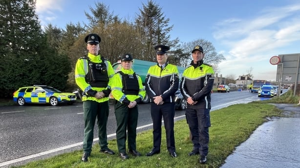 Gardaí and PSNI officers pose for a picture roadside