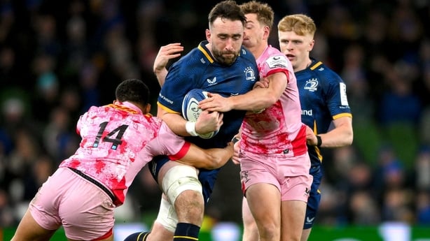 6 December 2025; Jack Conan of Leinster is tackled by Cassius Cleaves, left, and Will Porter of Harlequins during the Investec Champions Cup match between Leinster and Harlequins at the Aviva Stadium in Dublin. Photo by Shauna Clinton/Sportsfile
