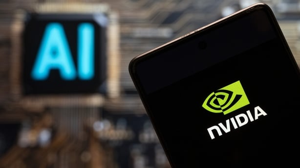 Nvidia logo displayed on a smartphone with an AI chip and symbol in the background