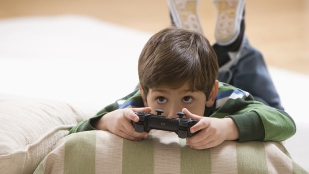 boy playing a computer game