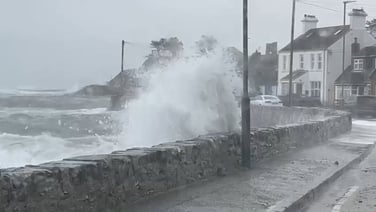 Wave crashes on sea wall in Killough, Co Down