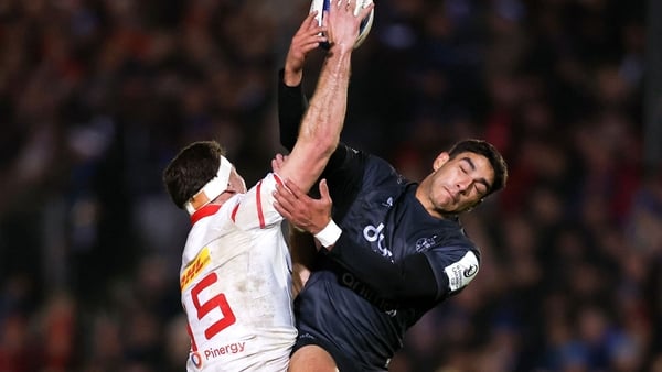 6 December 2025; Shane Daly of Munster and Santi Carreras of Bath contest a high ball during the Investec Champions Cup match between Bath and Munster at The Recreation Ground in Bath, England. Photo by Harry Murphy/Sportsfile