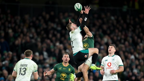 22 November 2025; Jack Crowley of Ireland contests a high ball with Cheslin Kolbe of South Africa during the Quilter Nations Series 2025 match between Ireland and South Africa at the Aviva Stadium in Dublin. Photo by Brendan Moran/Sportsfile