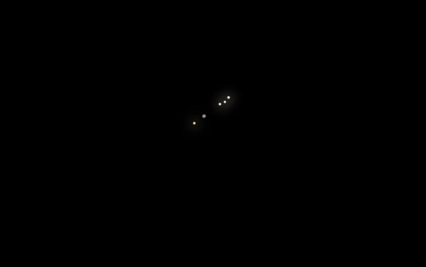 Jupiter and its four Galilean moons as it appears through a small telescope on Christmas night 2025.