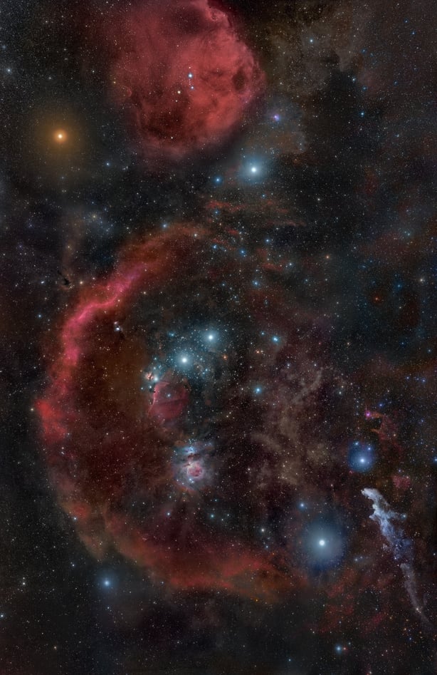 The constellation of Orion in all its glory showing Betelgeuse (upper left), Rigel (lower right), the Belt of Orion and Orion's Sword including the Orion Nebula, M42 as well as much of the Orion Molecular Cloud Complex including part of the Orion-Eridanus Super Bubble known as "Barnard's Loop"