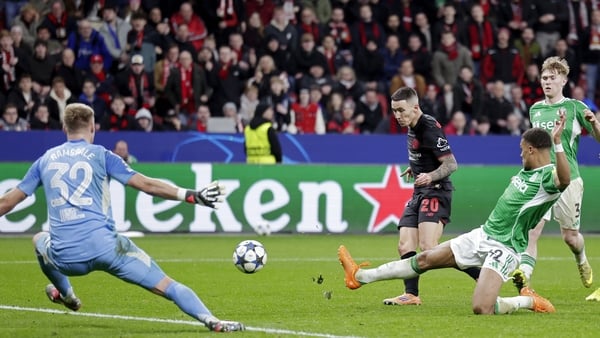Alejandro Grimaldo of Bayer Leverkusen scores to make it 2-2 against Newcastle Utd in Champions League, December 2025