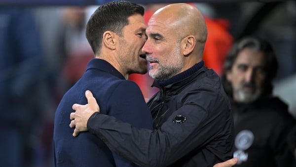 MADRID, SPAIN - DECEMBER 10: Head coach Xabi Alonso of Real Madrid and Head Coach Pep Guardiola of Manchester City greet each other before the UEFA Champions League week 6 football match between Real Madrid and Manchester City at Bernabeu Stadium in Madri