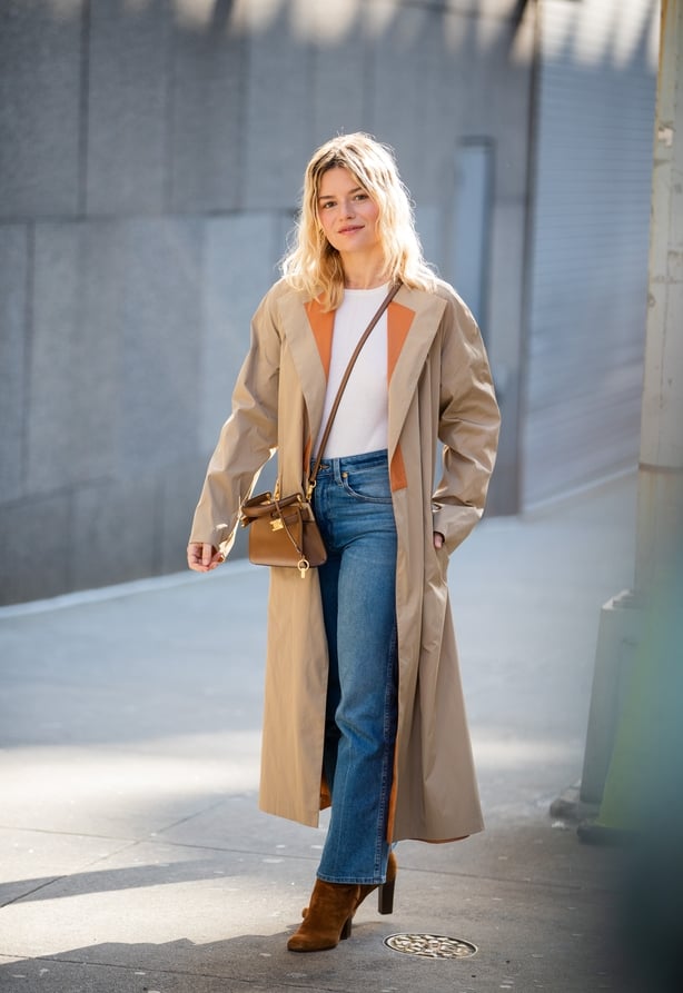 Sabina Socol is seen wearing trench coat, denim jeans outside Tory Burch during New York Fashion Week Fall / Winter in 2020 in New York City