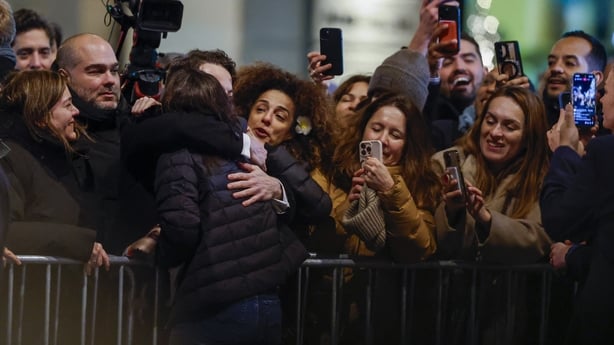 Nobel peace laureate Maria Corina Machado receives gifts from supporters gathered outside the Grand Hotel in Oslo
