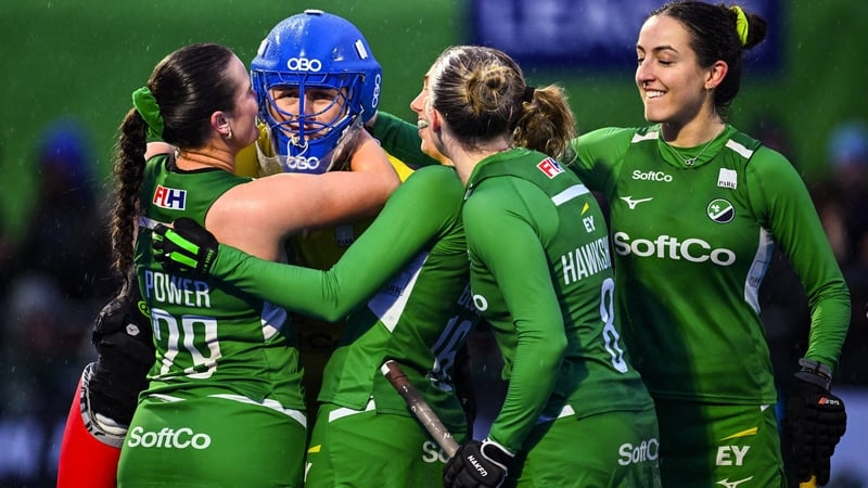 Lizzy Murphy is mobbed by her Ireland team-mates after the shootout