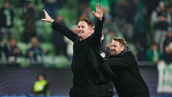 BUDAPEST, HUNGARY - DECEMBER 11: Ferencvaros Head Coach Robbie Keane (L) and Assistant Coach Phil Hudson celebrate at full time during a UEFA Europa League 2025/26 League Phase MD6 match between Ferencvaros and Rangers at the Groupama Arena, on December 1