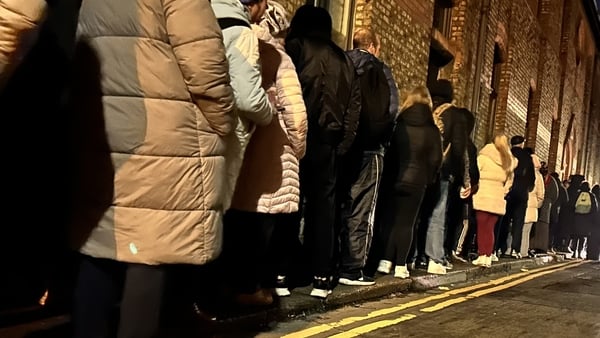 People queue up to receive food vouchers in Dublin city centre