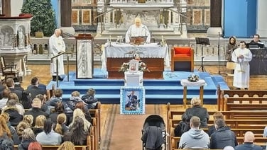 Fr Corcoran reads words from Tadhg's mother: he "filled a lifetime of love" into his four years