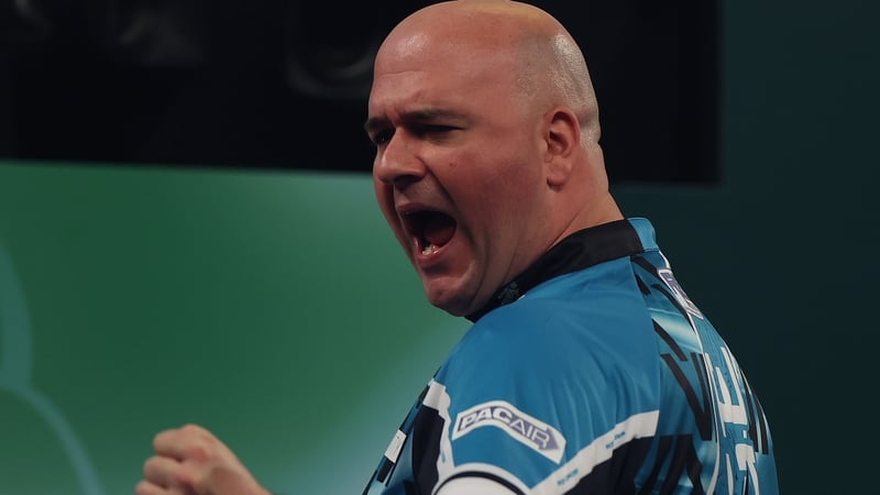 Rob Cross celebrates winning his match on day two at Alexandra Palace