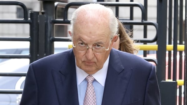 Photo shows businessman John Magnier as he leaves court