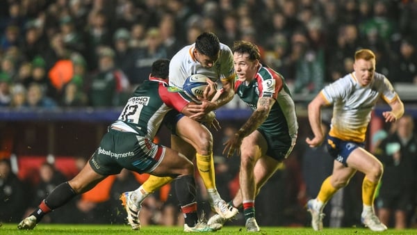 12 December 2025; Rieko Ioane of Leinster is tackled by Solomone Kata, left, and Will Wand of Leicester Tigers during the Investec Champions Cup match between Leicester Tigers and Leinster at Mattioli Woods Welford Road in Leicester, England. Photo by Bre