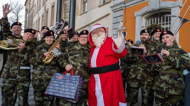 Santa posing with the Army band at the Mercy University Hospital during the Kinsale & District Lions Club Annual Christmas Toy Drop