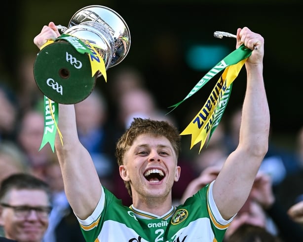 30 March 2025; Offaly captain Lee Pearson lifts the cup, as one of the handles comes off, after his side's victory in the Allianz Football League Division 3 final match between Kildare and Offaly at Croke Park in Dublin. Photo by Piaras Ó Mídheach/Sportsfile