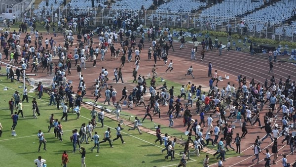 Clashes between fans and police are seen on the field during Lionel Messi's GOAT concert in Kolkata