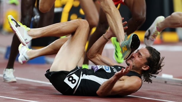 TOKYO, JAPAN - SEPTEMBER 13: Geordie Beamish of Team New Zealand avoids the foot of Jean-Simon Desgagnes of Team Canada as he falls to the ground during the the Men's 3000 Metres Steeplechase Heats on day one of the World Athletics Championships Tokyo 2025 at National Stadium on September 13, 2025 i