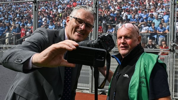 5 July 2025; Irish Examiner photographer Eddie O'Hare, who retired after today's game having served the paper for more than 47 years, is photographed with the Uachtarán Chumann Lúthchleas Gael Jarlath Burns before the GAA Hurling All-Ireland Senior Champi