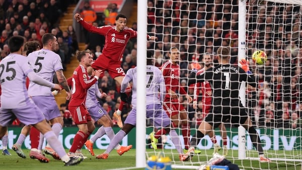 LIVERPOOL, ENGLAND - DECEMBER 13: Hugo Ekitike of Liverpool heads the ball to score his team's second goal during the Premier League match between Liverpool and Brighton & Hove Albion at Anfield on December 13, 2025 in Liverpool, England. (Photo by Carl R