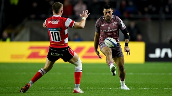 13 December 2025; Dan Kelly of Munster kicks pasts Charlie Atkinson of Gloucester during the Investec Champions Cup match between Munster and Gloucester at SuperValu Páirc Ui Chaoimh in Cork. Photo by Brendan Moran/Sportsfile