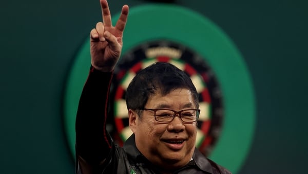 LONDON, ENGLAND - DECEMBER 13: Paul Lim of Singapore celebrates after winning his match on Day Three of the 2025/26 Paddy Power World Darts Championship at Alexandra Palace on December 13, 2025 in London, England. (Photo by Andrew Redington/Getty Images)