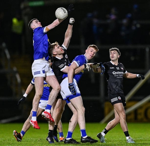 13 December 2025; Mícheál McCarville of Scotstown in action against Aaron Morgan of Kilcoo during the AIB Ulster GAA Football Senior Club Championship final match between Kilcoo and Scotstown at BOX-IT Athletic Grounds in Armagh. Photo by Ramsey Cardy/Sportsfile