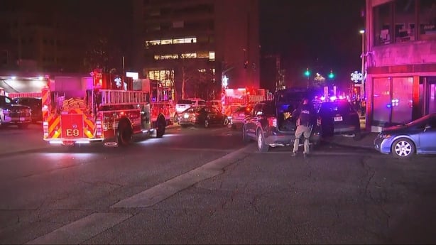 Fire engine and police officers stand on street at Brown University.