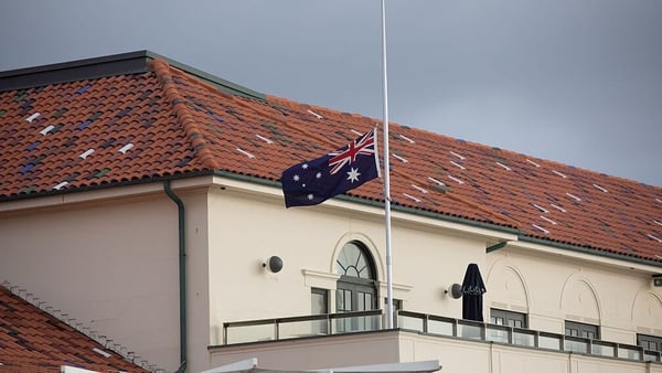 An Australian flag flies at half mast at Bondi Pavilion, following the mass shooting at Bondi Beach in Sydney