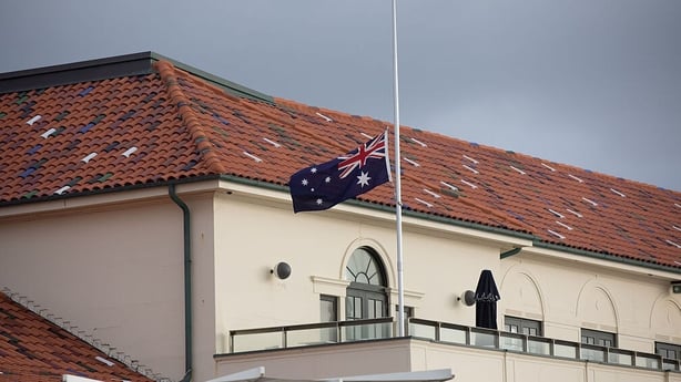 An Australian flag flies at half mast at Bondi Pavilion, following the mass shooting at Bondi Beach in Sydney