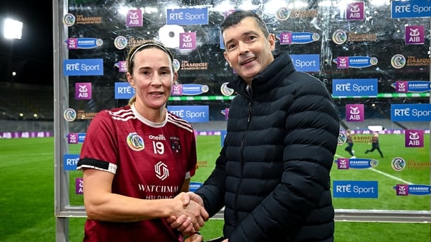 14 December 2025; Therese Donohue of Athenry receives the Player of the Match award from David Crimmins, representing AIB, after the AIB All-Ireland Camogie Senior Club Championship final match between Athenry of Galway and St Finbarr's of Cork at Croke Park in Dublin. Photo by Seb Daly/Sportsfile 