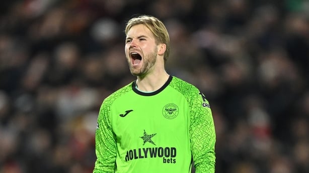 BRENTFORD, ENGLAND - DECEMBER 14: Caoimhin Kelleher of Brentford celebrates his team's first goal scored by teammate Jordan Henderson (not pictured) during the Premier League match between Brentford and Leeds United at Gtech Community Stadium on December 14, 2025 in Brentford, England. (Photo by Mik