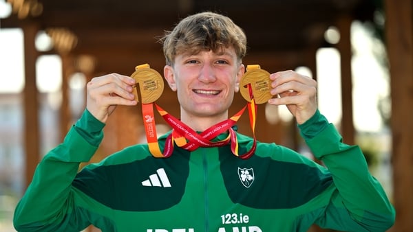 14 December 2025; Nick Griggs of Ireland with his U23 men's individual and team gold medals during the 2025 SPAR European Cross Country Championships in Lagoa, Portugal. Photo by Sam Barnes/Sportsfile